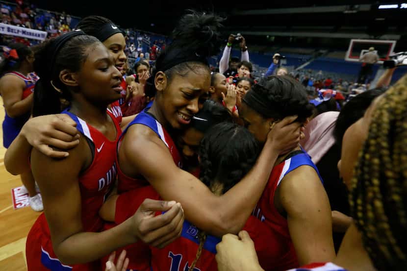 Duncanville's Zarielle Green (middle) and her teammates celebrate a 76-65 win over Houston...