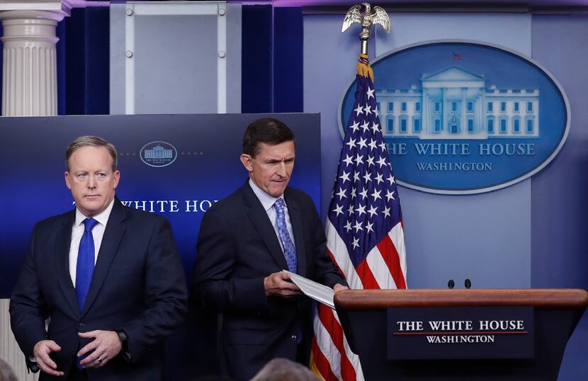 Michael Flynn (right) with White House press secretary Sean Spicer (AP Photo/Carolyn Kaster,...