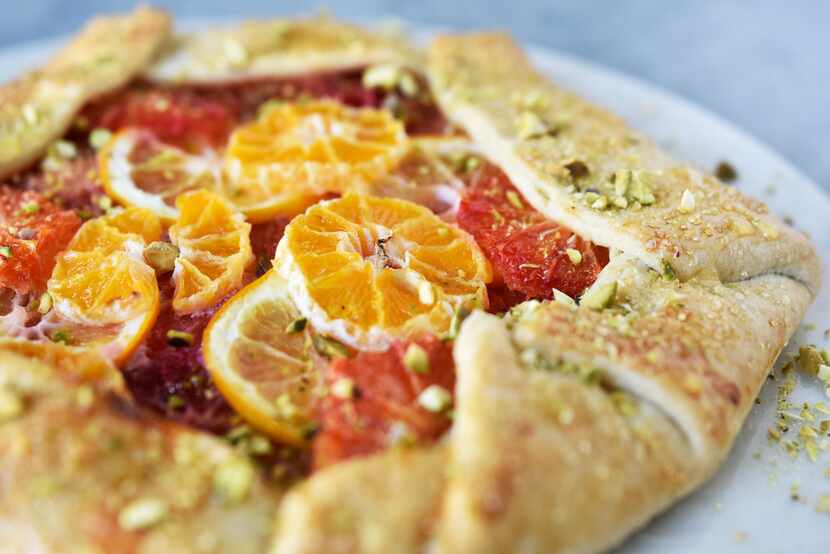 Rustic citrus galette gets a sprinkling of sugar for sweetness and a scattering of...