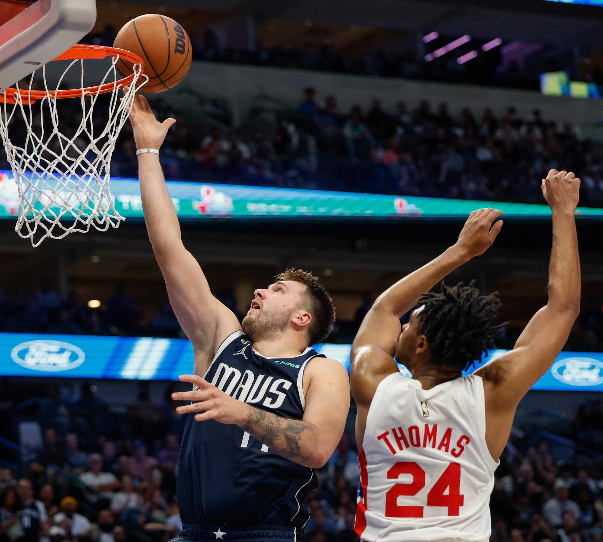 Dallas Mavericks guard Luka Doncic (77) attempts a layup against Brooklyn Nets guard Cam...