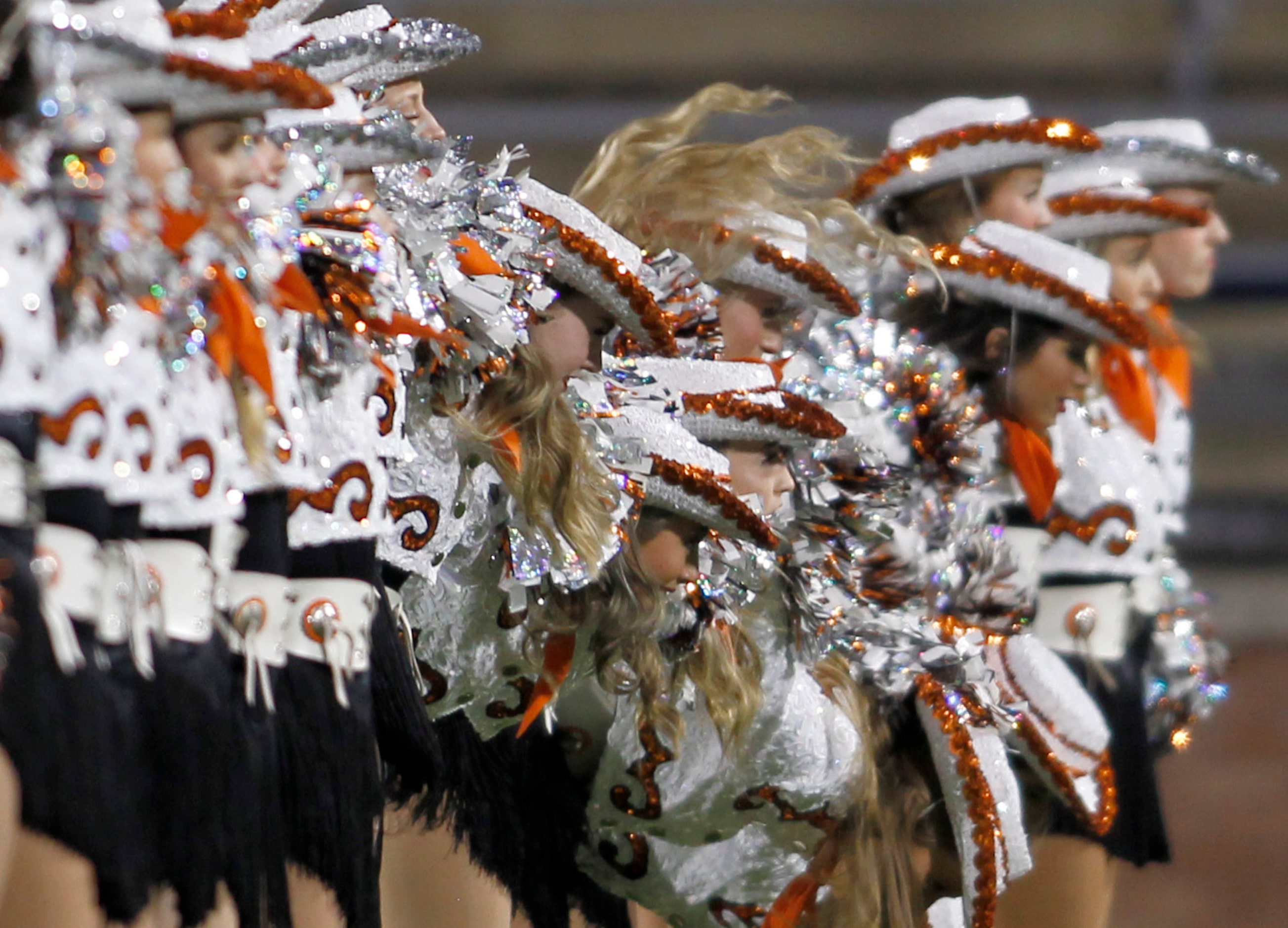 Rockwall drill team members perform on the field prior to the opening kickoff of their game...