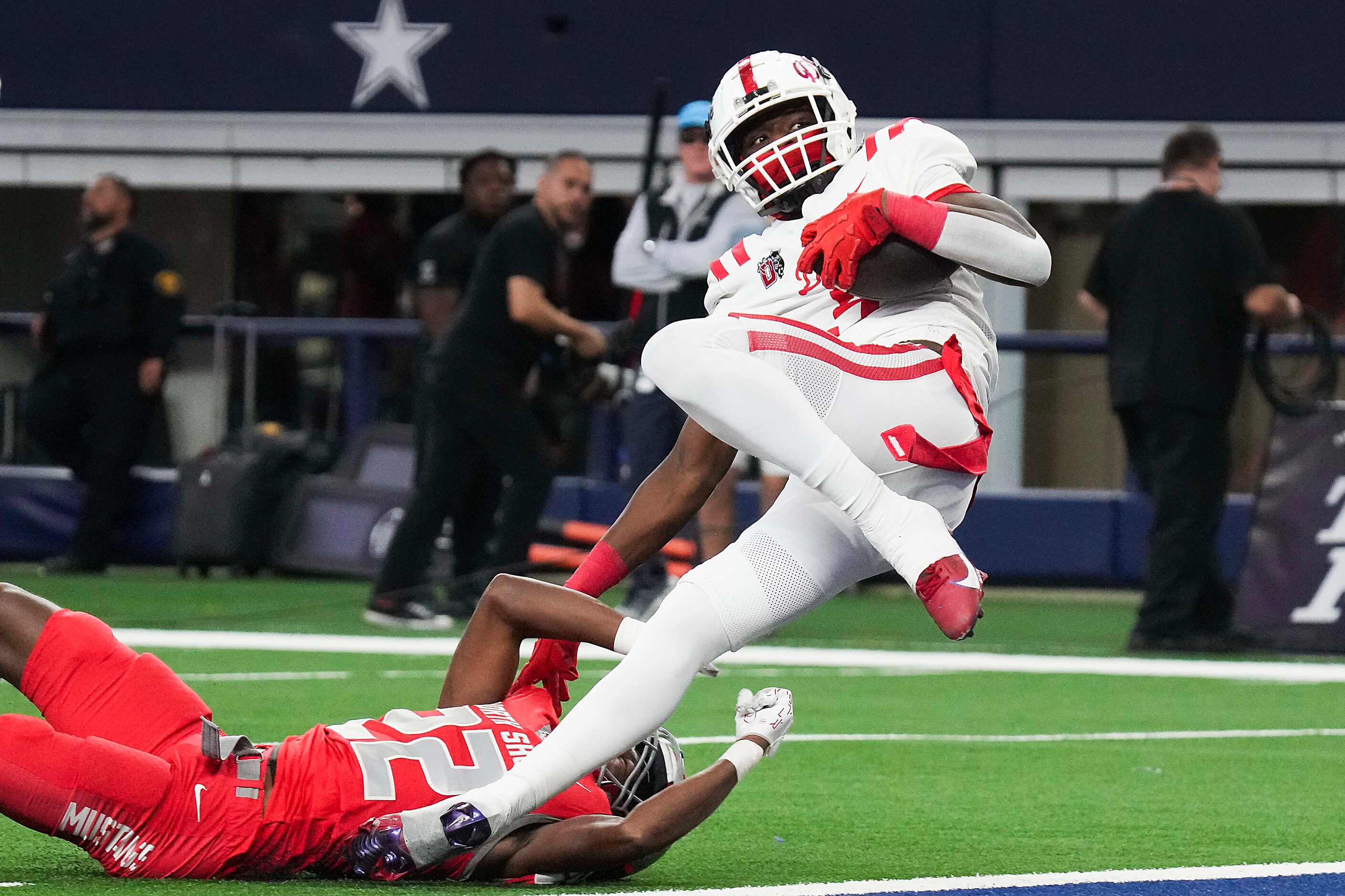 Duncanville’s Zach Turner (9) scores past Galena Park North Shore Khamani Hudson (22) on a...