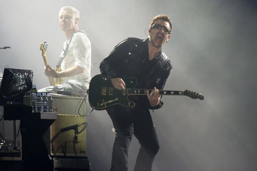 FILE - In this July 20, 2011 file photo, Bono, right, and Adam Clayton, from the rock group...