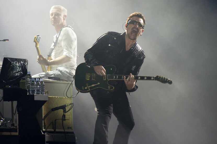 FILE - In this July 20, 2011 file photo, Bono, right, and Adam Clayton, from the rock group...