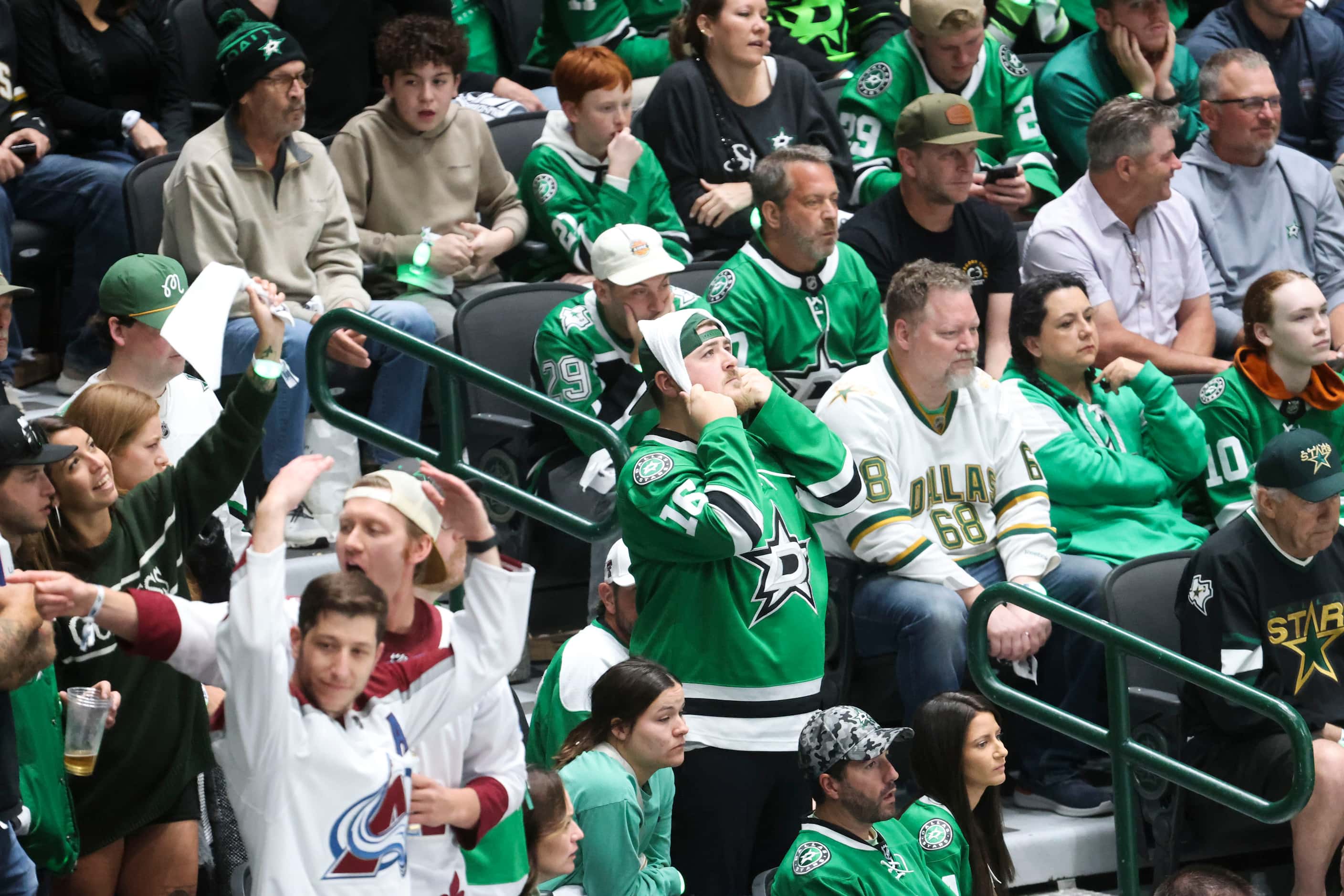 Dallas Stars fans remain tensed during the last minute of the third period with the score...
