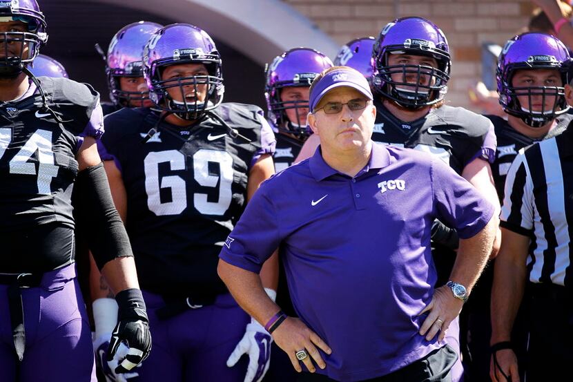 TCU Horned Frogs head coach Gary Patterson and his players wait to take the field against...