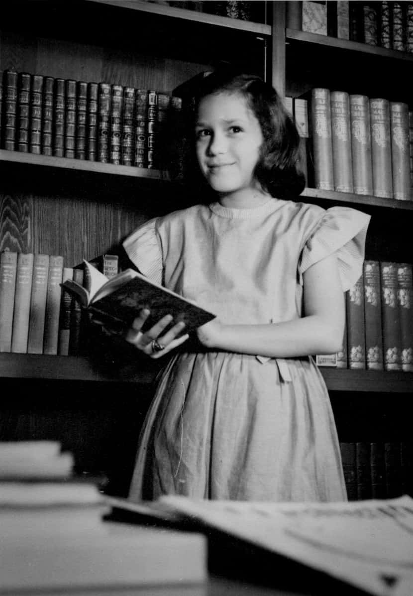The author, Jerrie Marcus Smith, photographed at 10 years old in her father's library in her...
