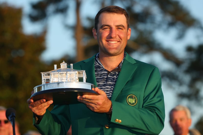 Scottie Scheffler poses with the Masters trophy during the Green Jacket Ceremony after...