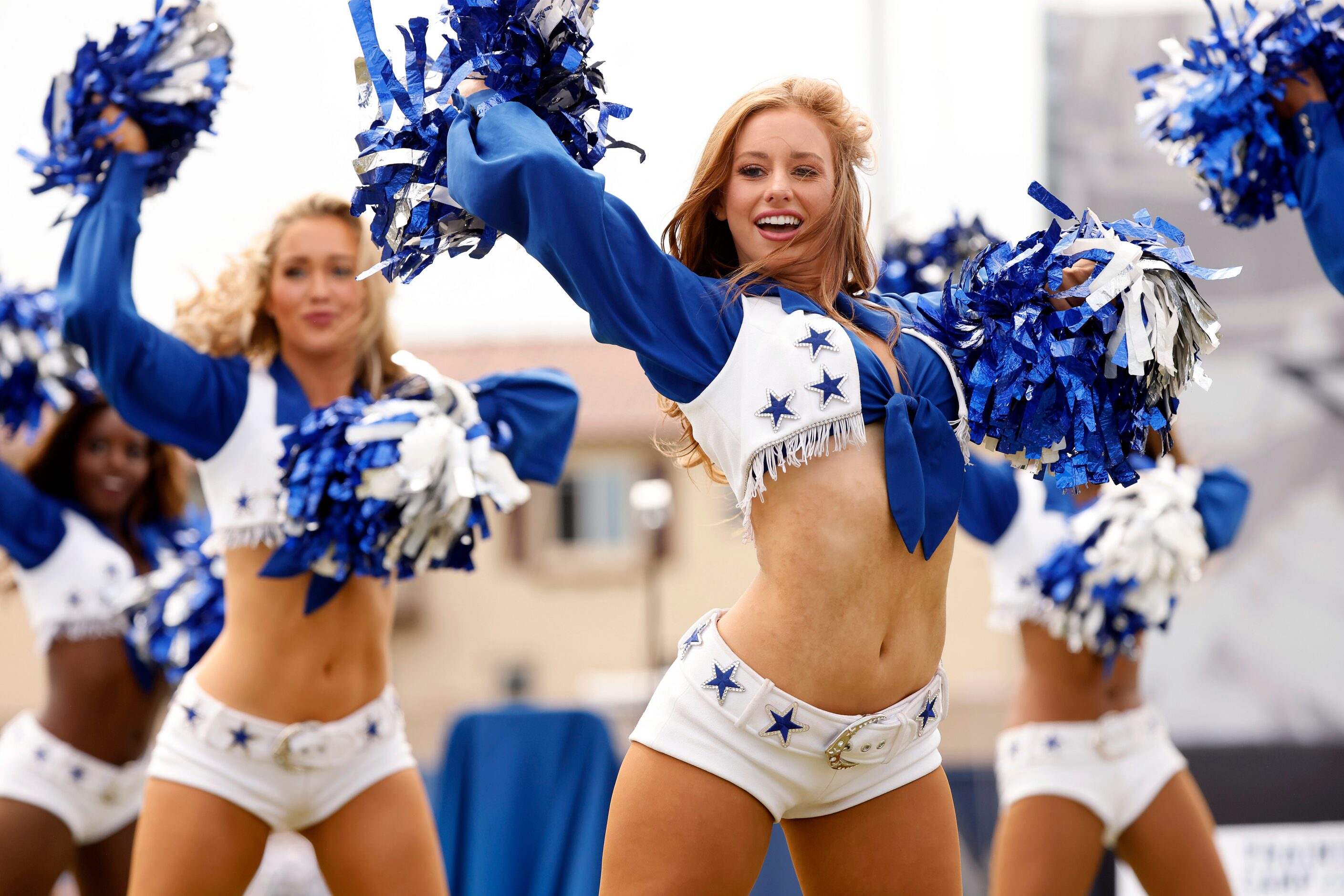 The Dallas Cowboys Cheerleaders perform during the Cowboys training camp opening ceremonies...