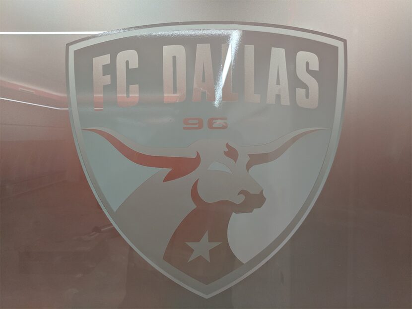 Etched glass on one of the FC Dallas locker room doors. 