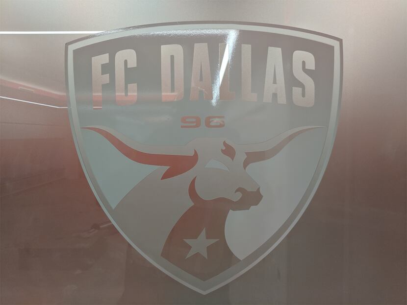 Etched glass on one of the FC Dallas locker room doors. 