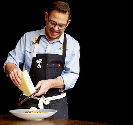 Chef John Tesar garnishes pasta for his new restaurant, Knife Italian.