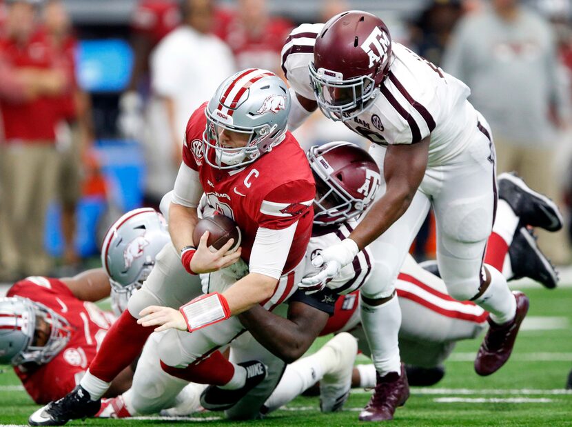 Arkansas Razorbacks quarterback Austin Allen (8) is sacked by Texas A&M Aggies linebacker...