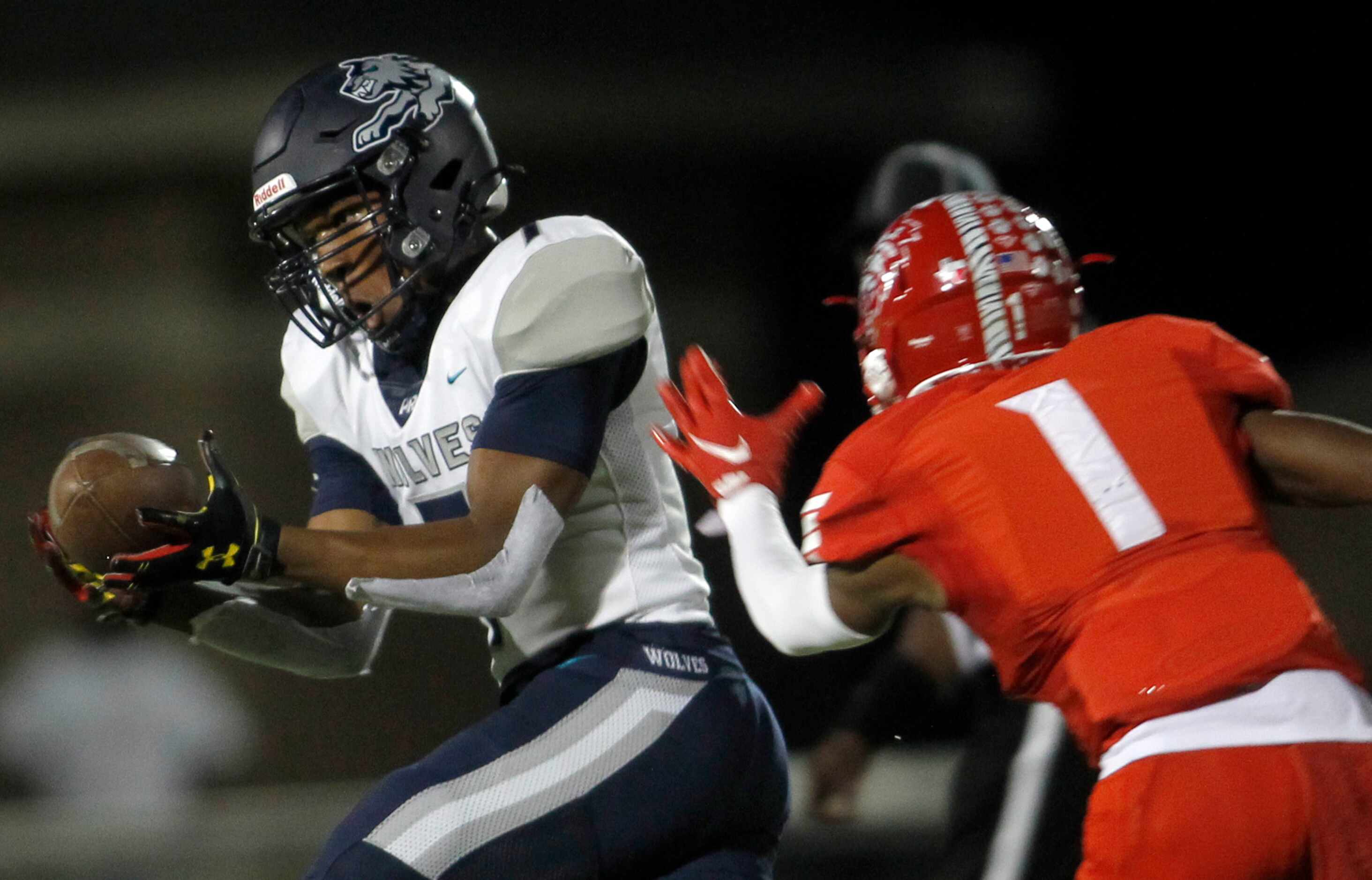 Carrollton Ranchview receiver Chris Kelly (7) pulls in a long reception in front of the...