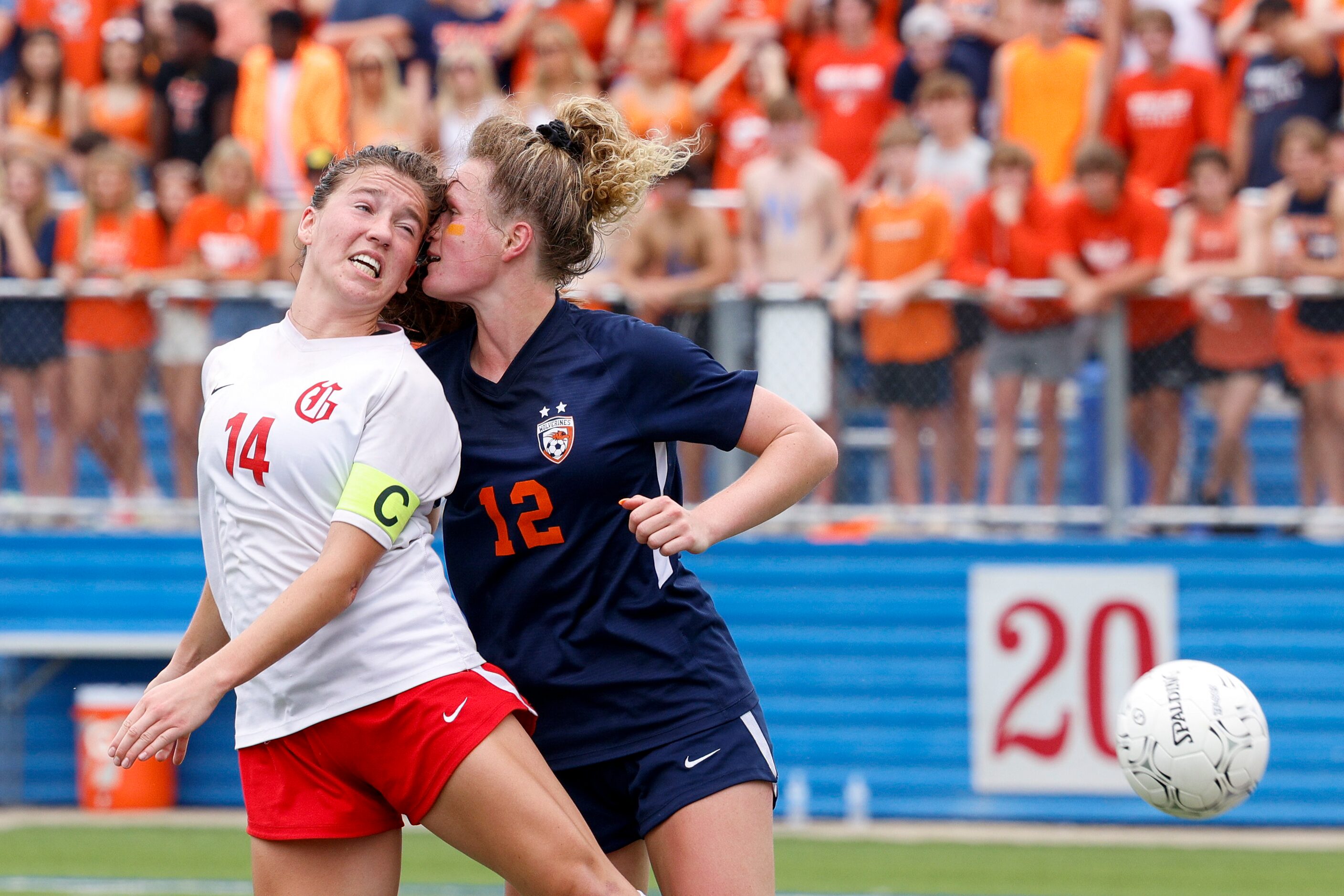 Grapevine forward Theresa McCullough (14) collides with Frisco Wakeland forward Katy Gregson...