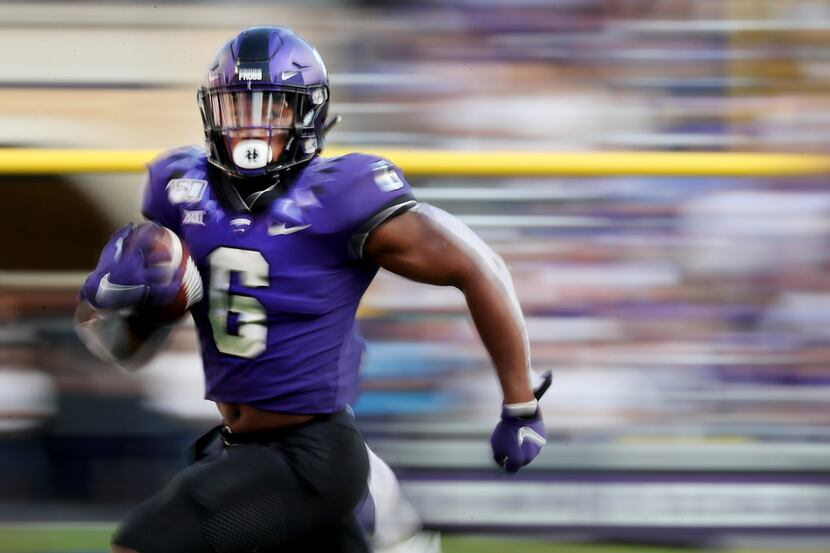 FORT WORTH, TEXAS - SEPTEMBER 21: Darius Anderson #6 of the TCU Horned Frogs carries the...