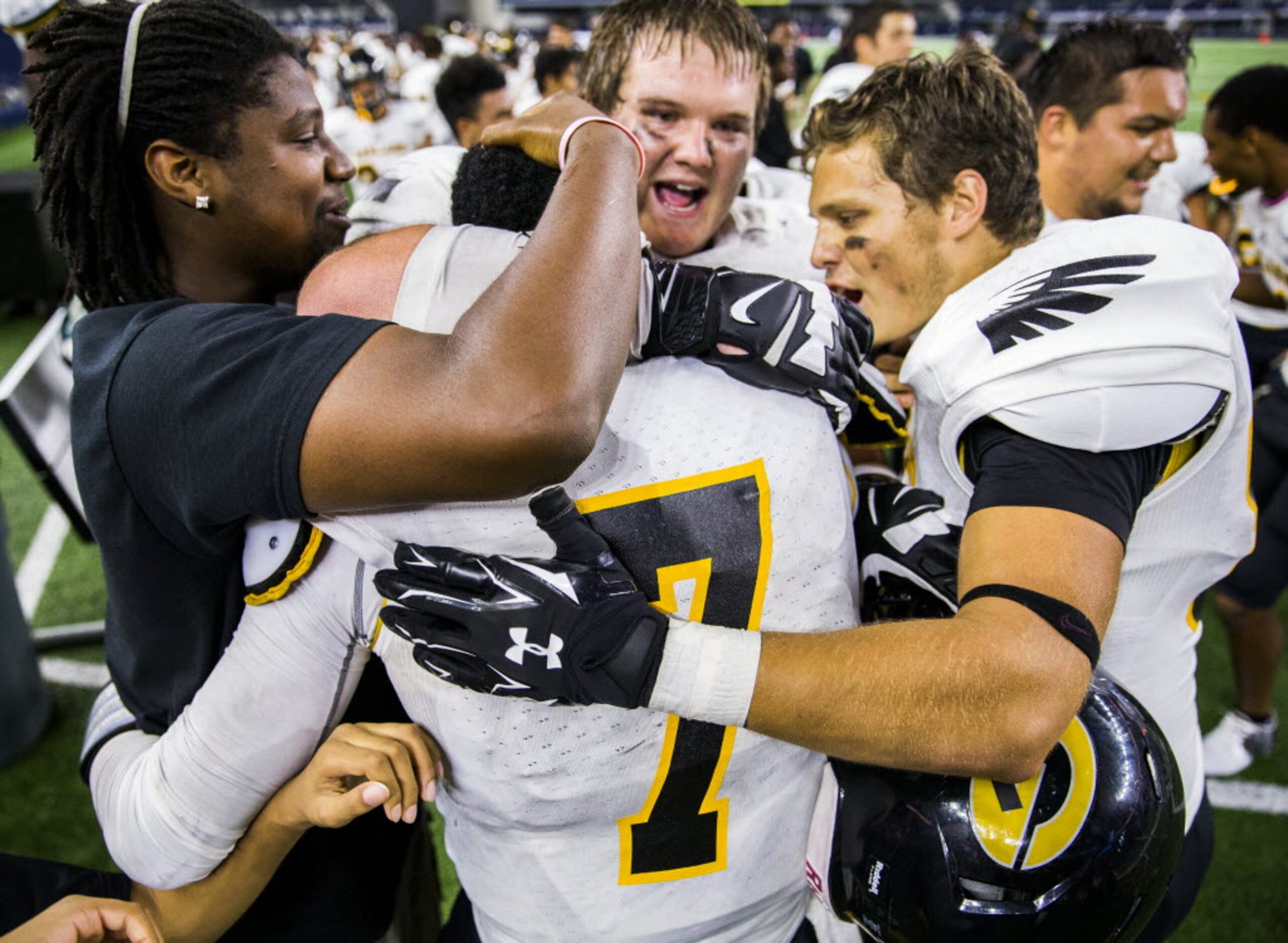 Garland quarterback Jacoby Williams (7) celebrates with team mates just before the end of...