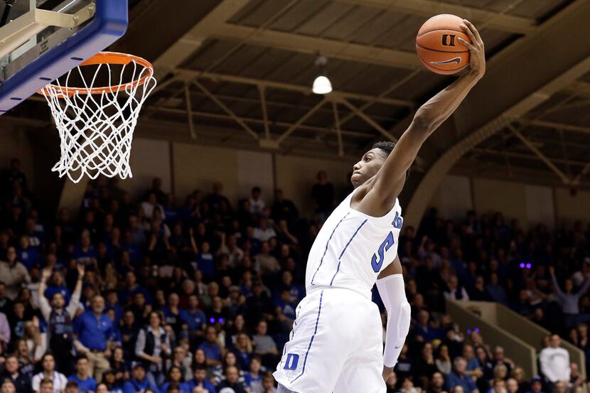 Duke's RJ Barrett drives for a dunk against Yale during the second half of an NCAA college...