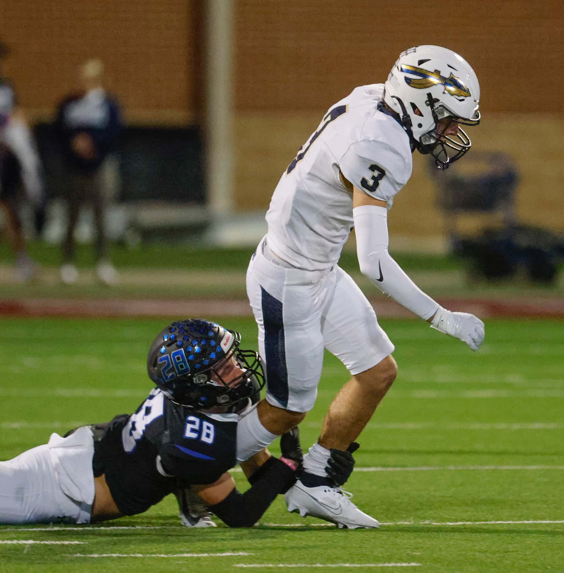Byron Nelson High’s Preston Martinson (28) tackles Keller high’s Will Adams during the first...