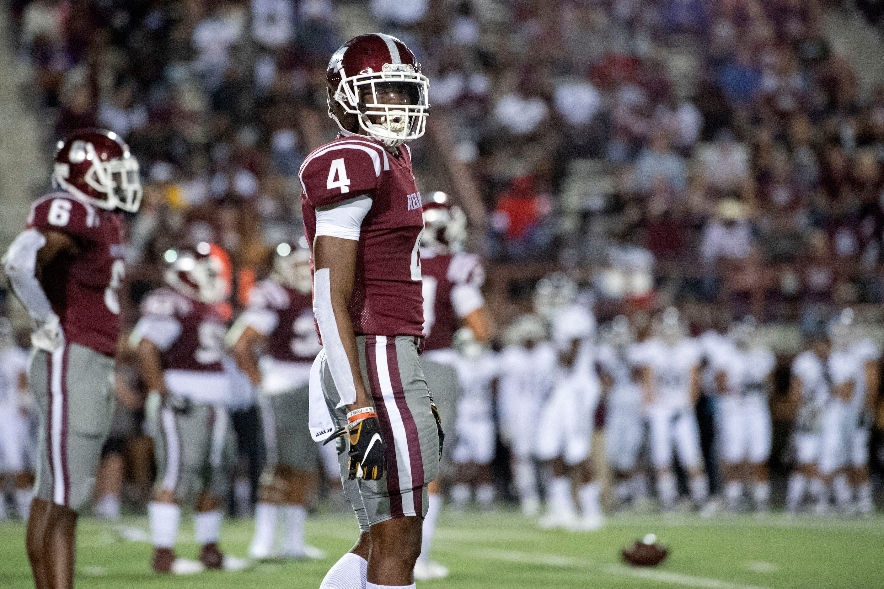 Red Oak senior cornerback Darius Jackson pauses between plays during the first half of a...