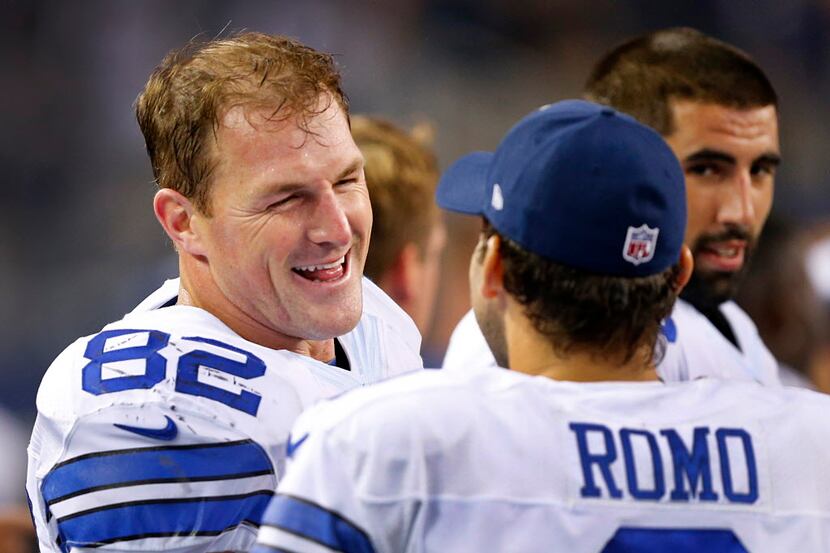 Dallas Cowboys tight end Jason Witten (82) and quarterback Tony Romo (9) share a laugh on...