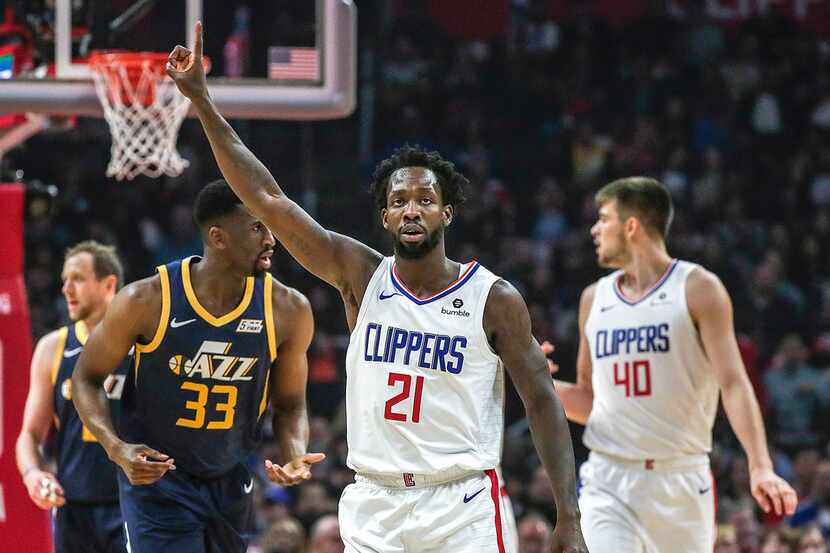 FILE - The Los Angeles Clippers' Patrick Beverley (21) celebrates after causing a Utah Jazz...