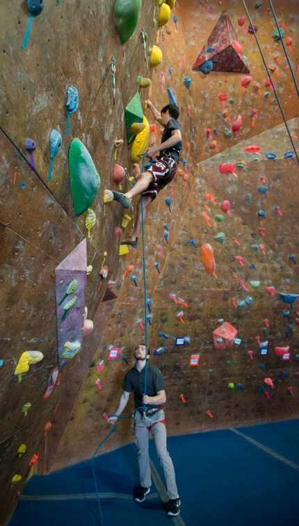 Boris Minot gets climbing tips from instructor Ben Jensen during a members-only training...
