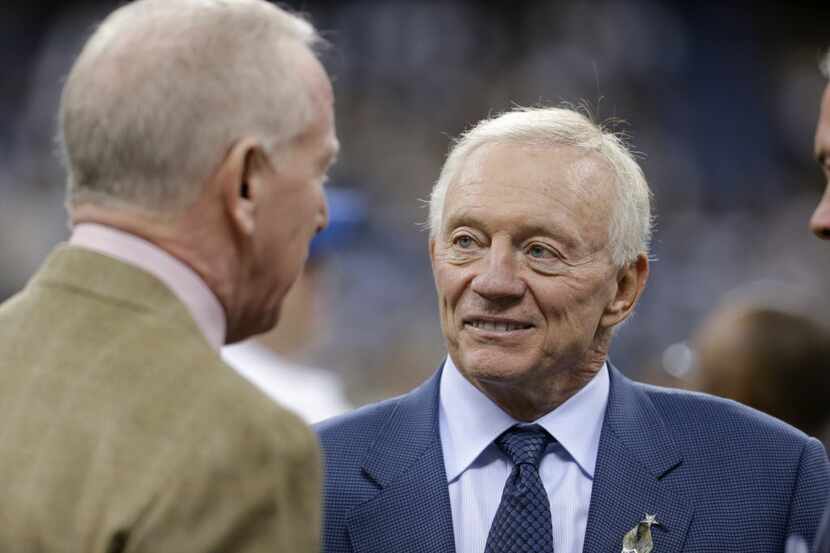 Dallas Cowboys owner Jerry Jones, right, talks with former New Orleans Saints quarterback...