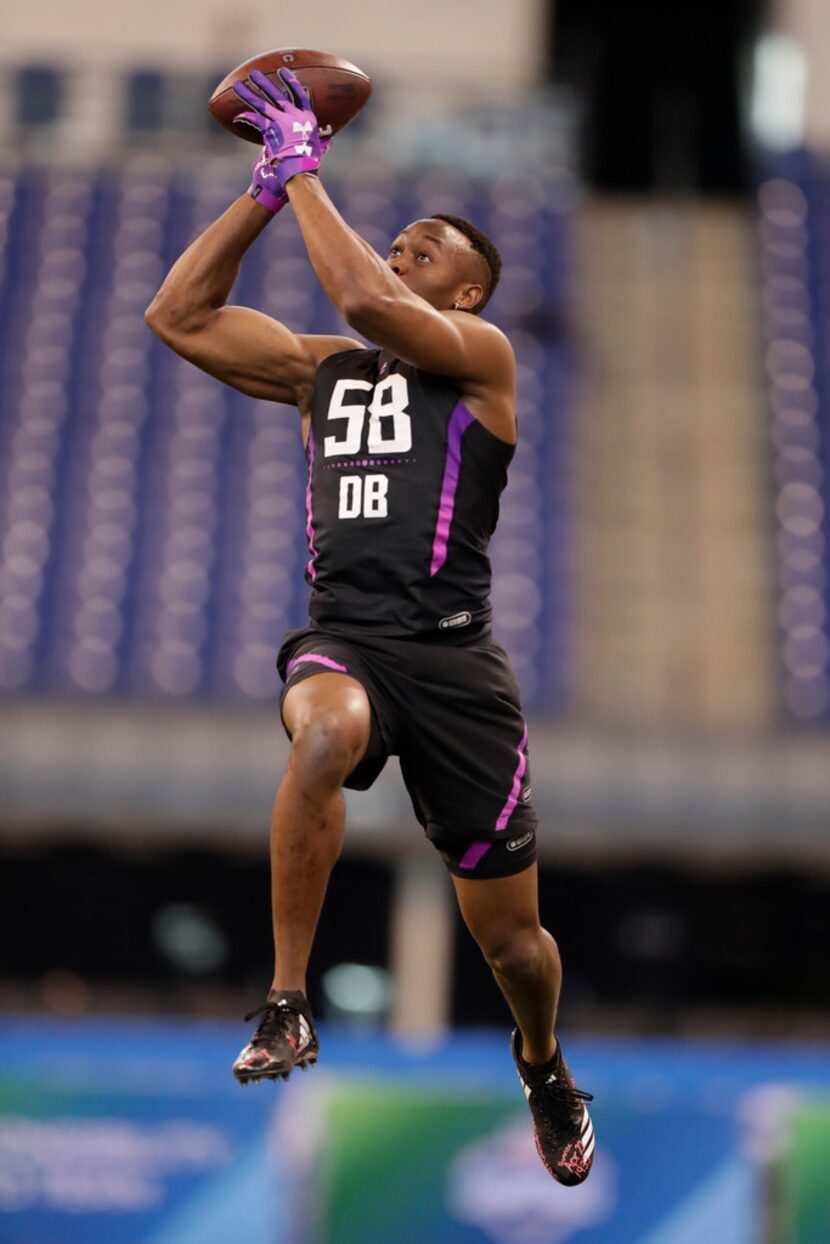 Nebraska defensive back Joshua Kalu makes a catch as he runs a drill at the NFL football...