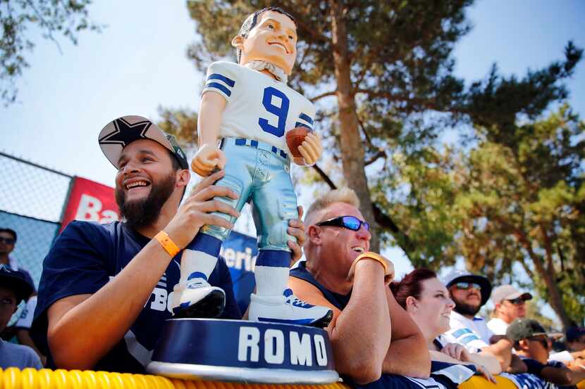 Dallas Cowboys fan Alex Hurtado of San Diego (left) brought his hug bobblehead of Cowboys...