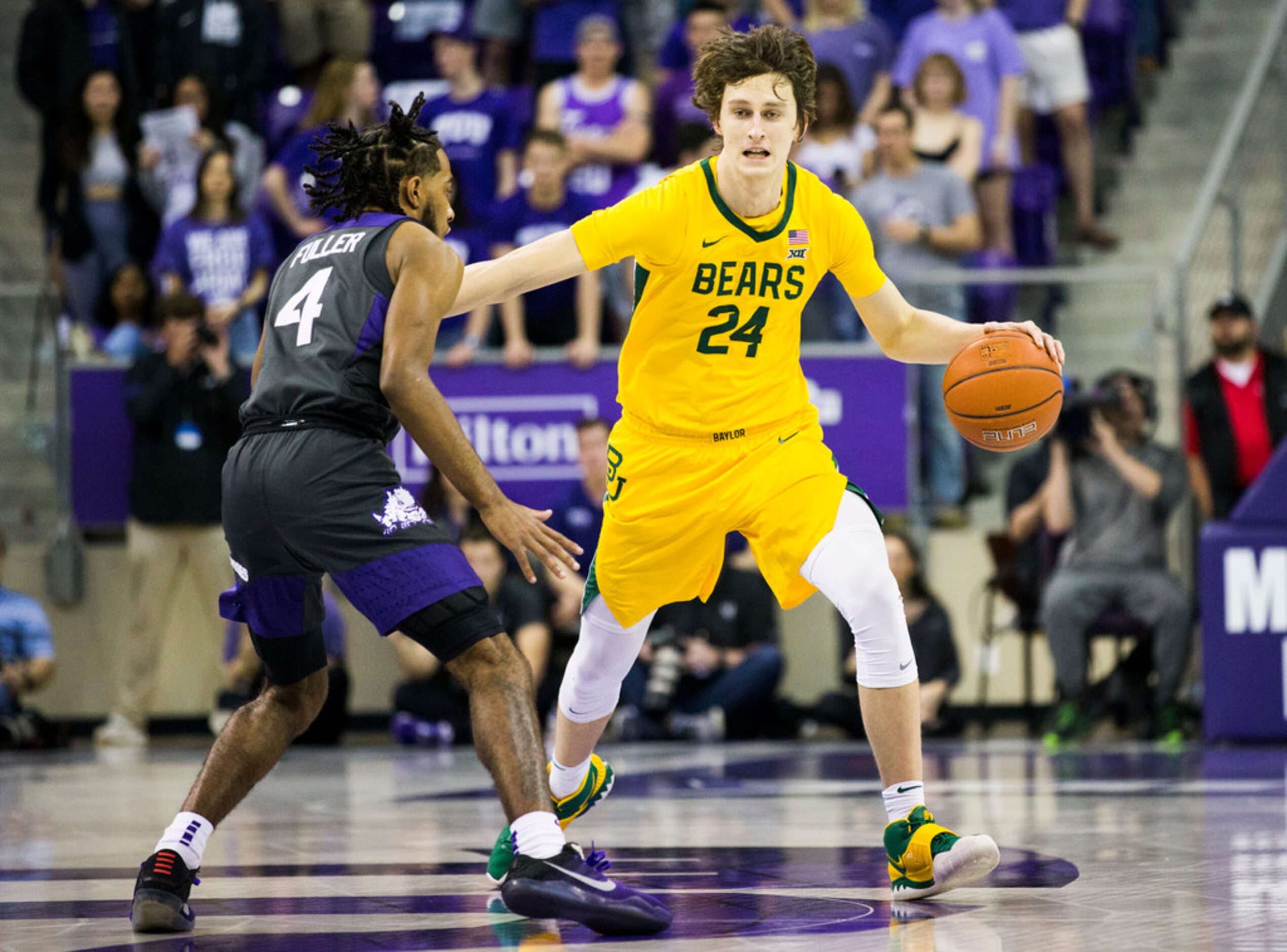 Baylor Bears guard Matthew Mayer (24) gets past TCU Horned Frogs guard PJ Fuller (4) during...