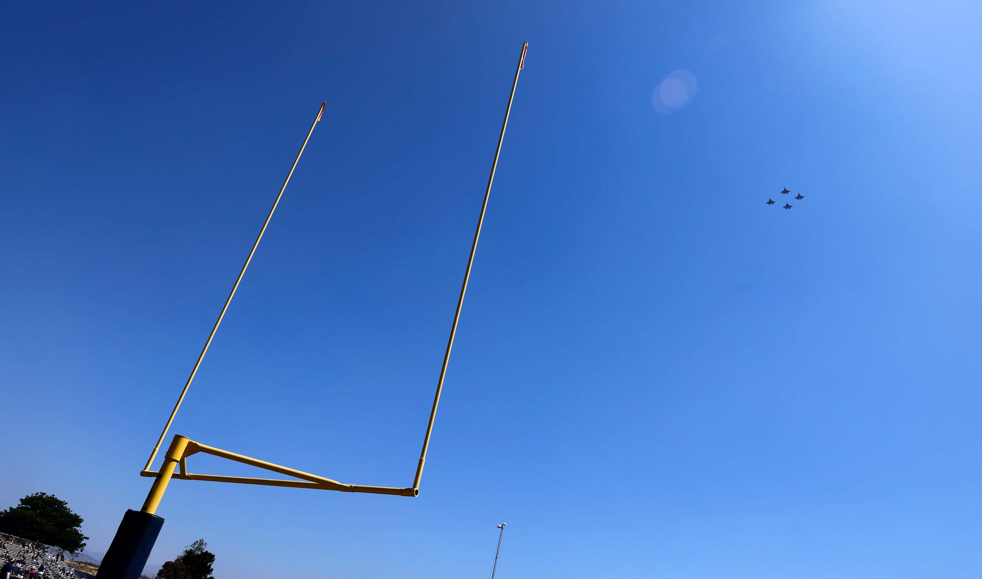 Four F-35 military aircraft perform a flyover of the Dallas Cowboys training camp practice...