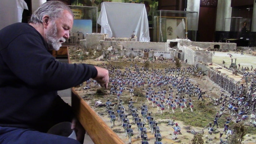 Artist Thomas Feely works on his enormous diorama about the Alamo, which will have its debut...