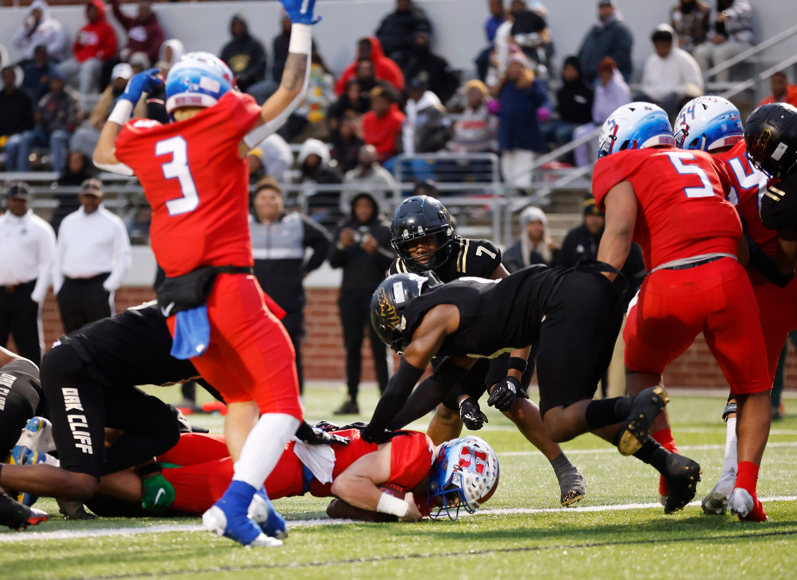 Midlothian Heritage quarterback Kaden Brown (2) dives across the goal line for a second half...