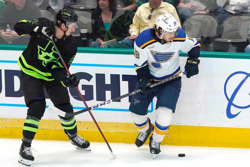 St. Louis Blues center Robert Thomas (18) and Dallas Stars left wing Mason Marchment (27)...