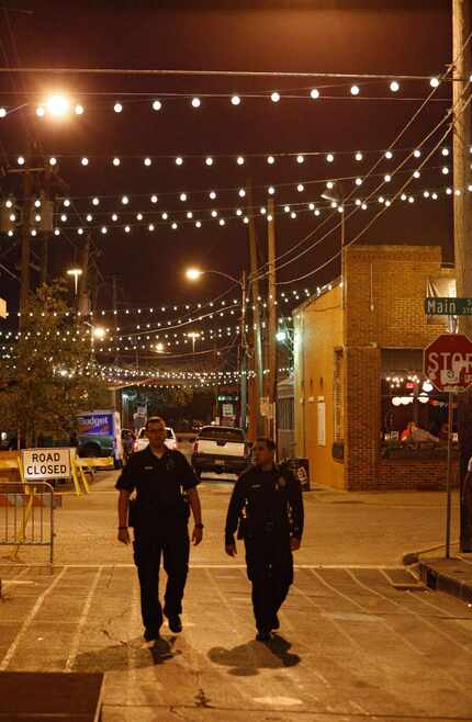 The Dallas PD officers seen here, walking the streets of Deep Ellum, were working a private...
