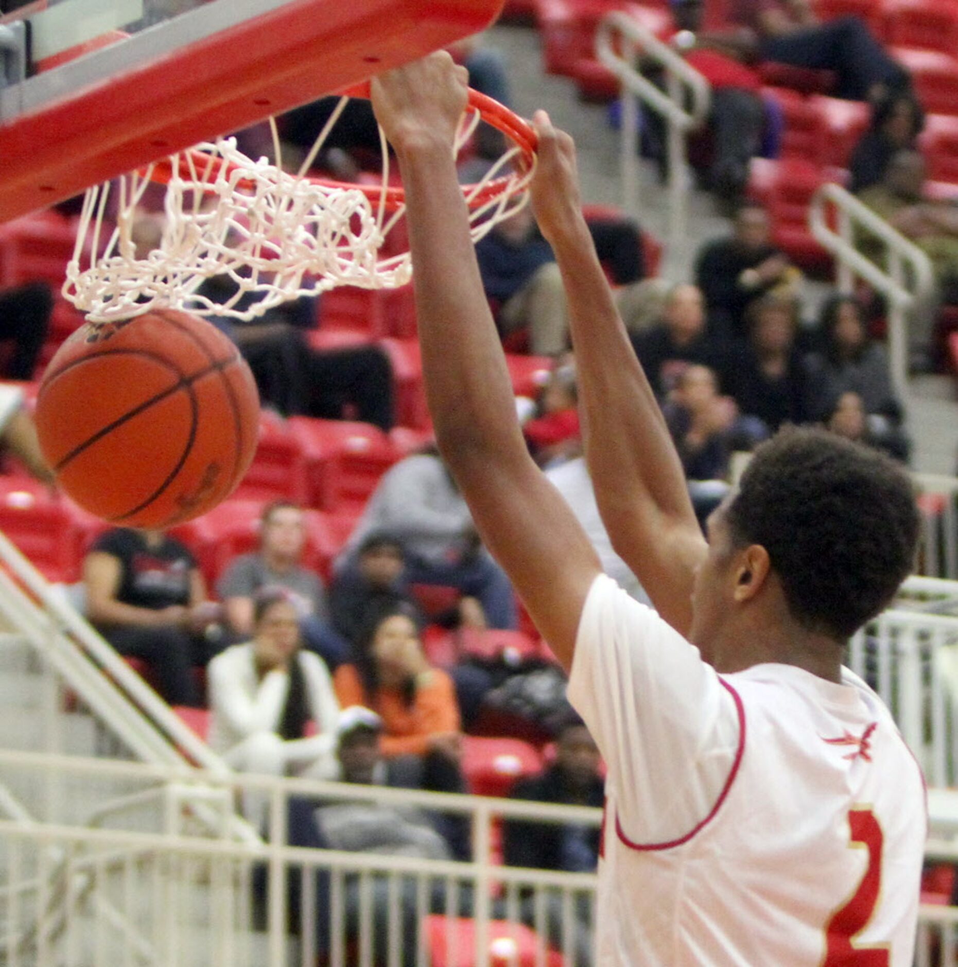 South Grand Prairie forward Harrison Henderson (2) finishes a fast break with a dunk during...