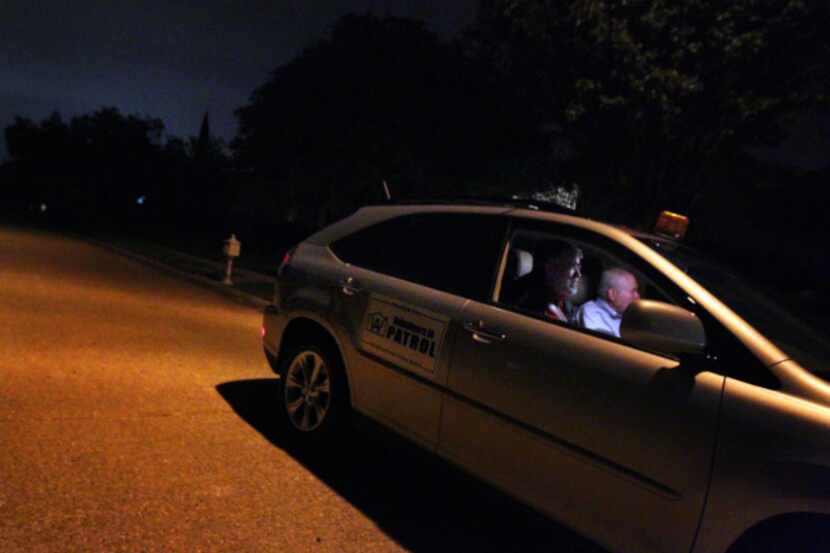 Paul Landfair (left) and Jim Thomas, make their Crime Watch patrol rounds in the Woodbriar...