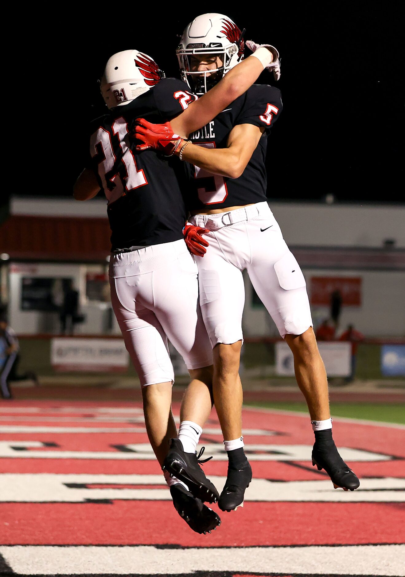 Argyle running back Peyton Shoemake (21) and wide receiver Hayden Stewart (5) celebrate a...