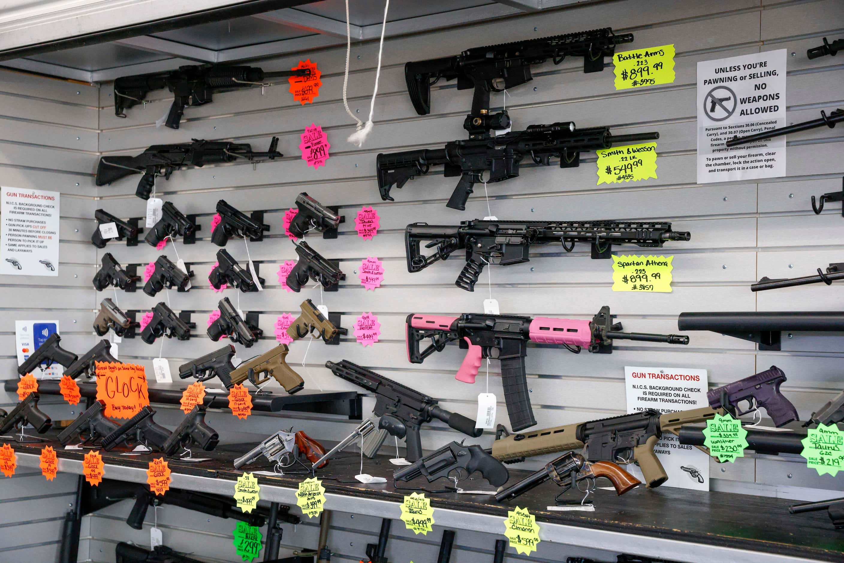 Various types of guns on display for sale at Uncle Dan’s Pawn Shop in Mesquite, Texas,...