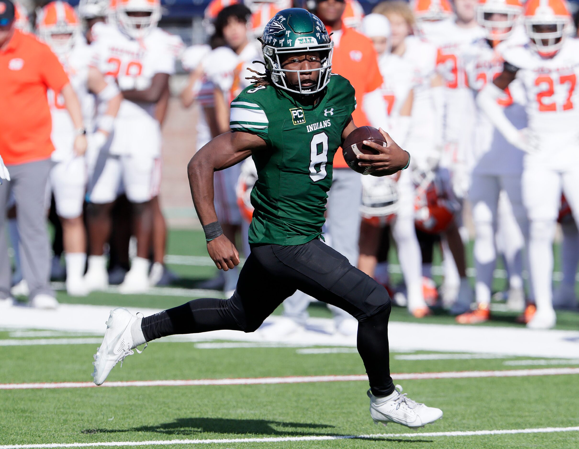 Waxahachie High School quarterback Ramon McKinney Jr. (8) carries the football to the end...