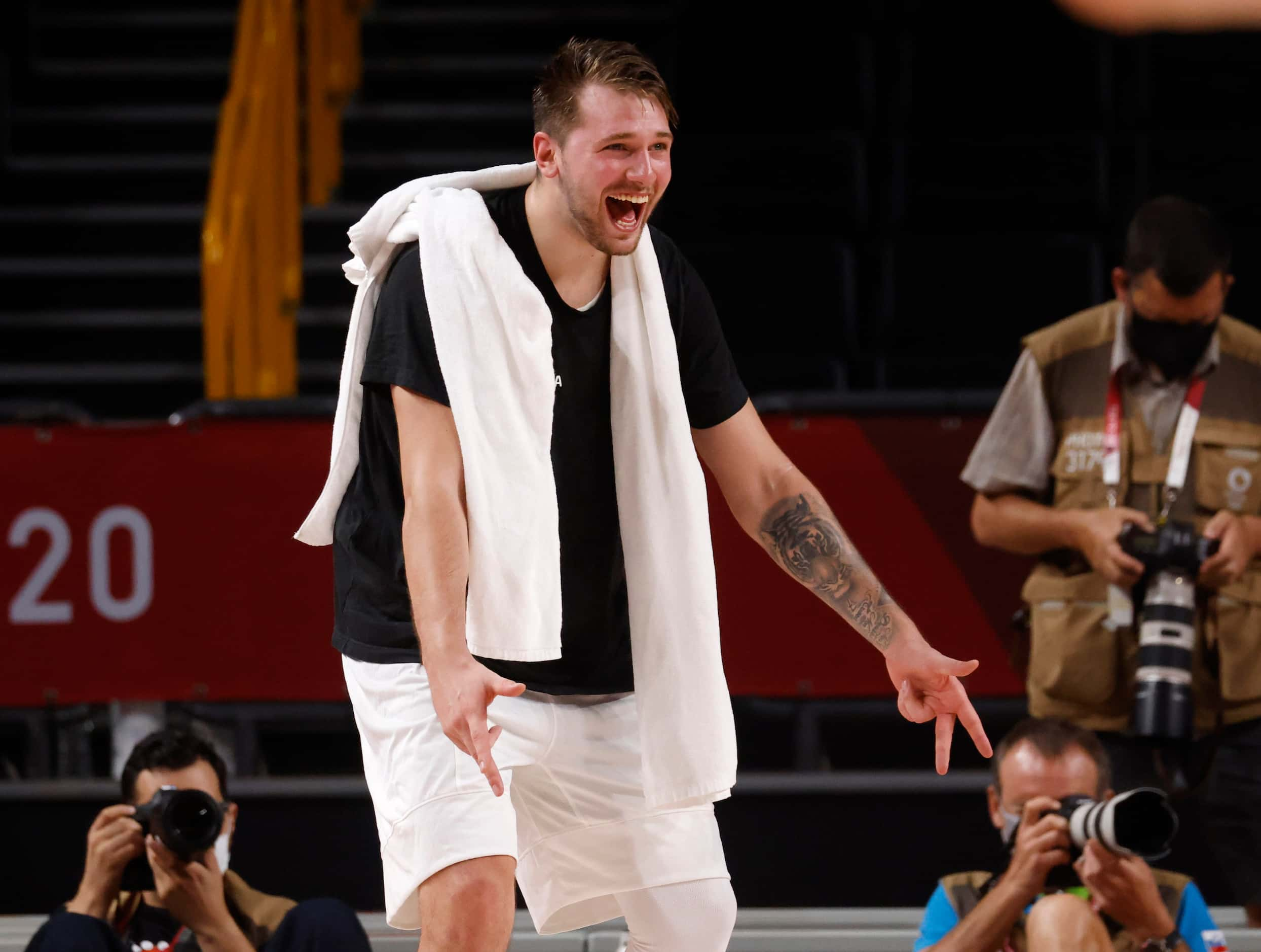 Slovenia’s Luka Doncic (77) celebrates after a made basket as they play Germany during the...