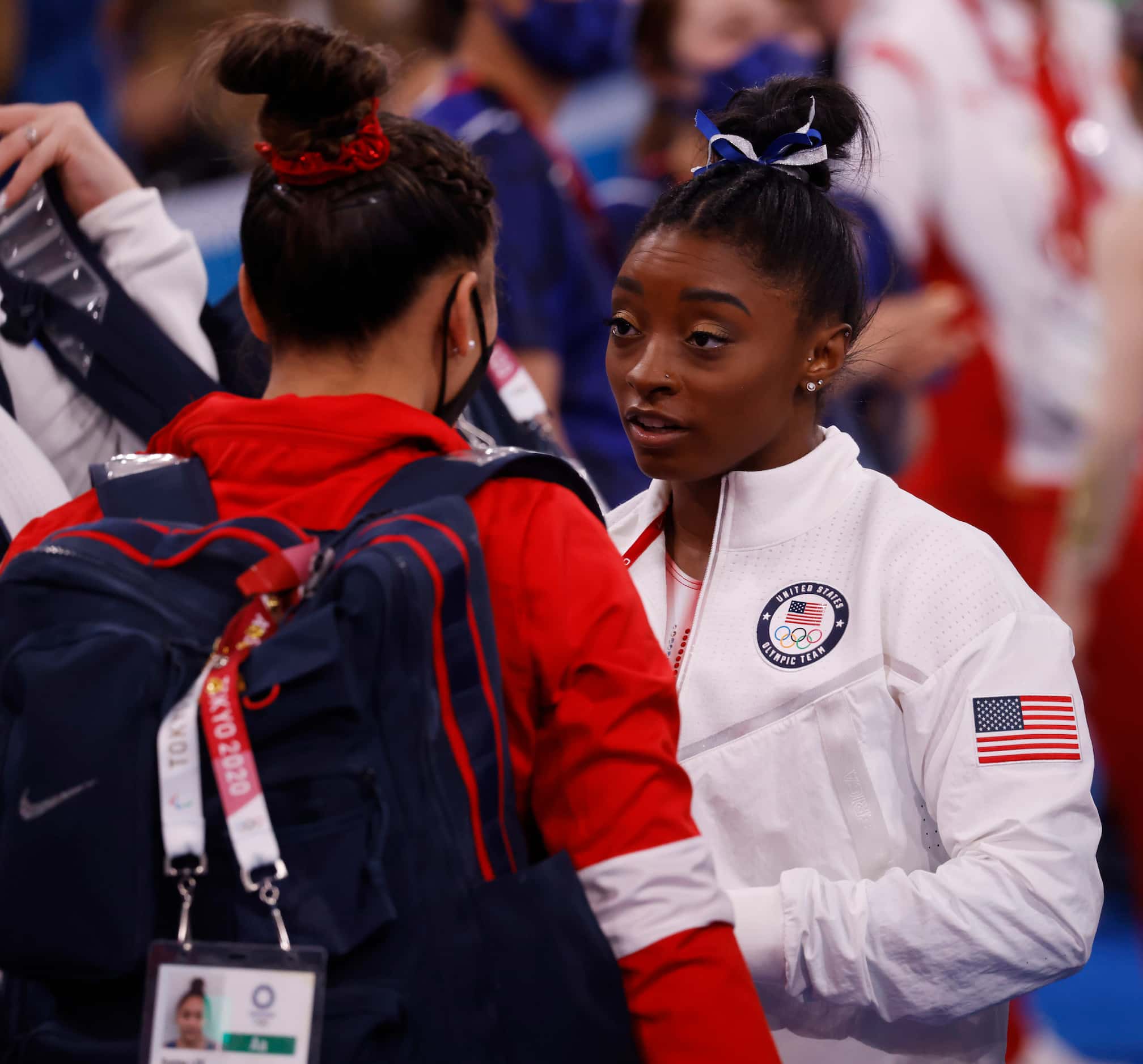 USA’s Simone Biles and Sunisa Lee talk after the women’s balance beam final at the postponed...