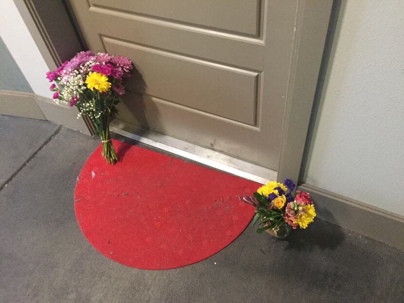 Flowers at the front door of Botham Shem Jean, who Dallas police say was shot Thursday by an...
