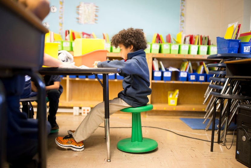 Jaxon Youngblood, 7, sits on a wobble stool donated through DonorsChoose.org at Hexter...