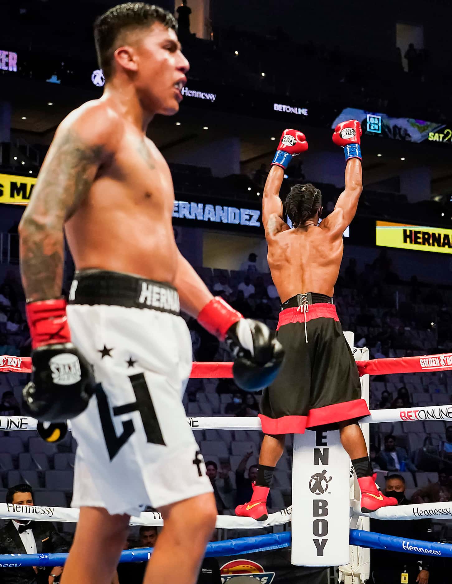 Alex Martin celebrates after defeating Luis Hernandez in a super lightweight bout at Dickies...