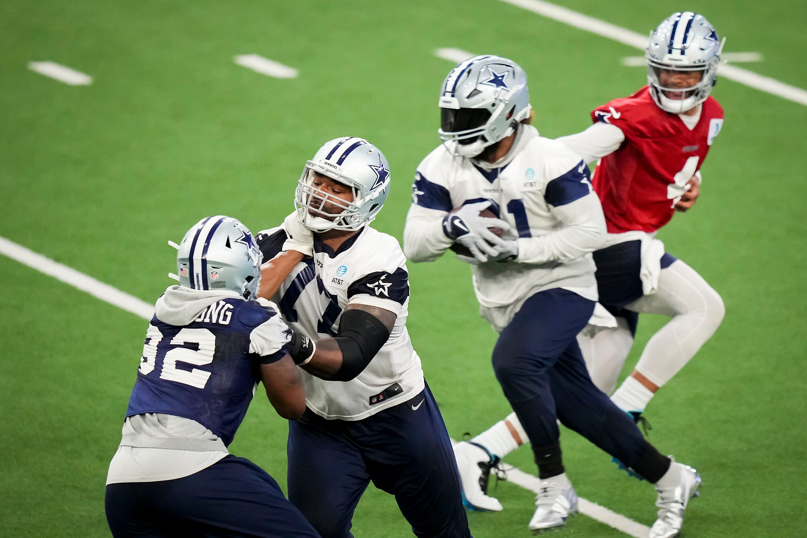 Dallas Cowboys tackle Tyron Smith (77) works against defensive end Dorance Armstrong (92) as...