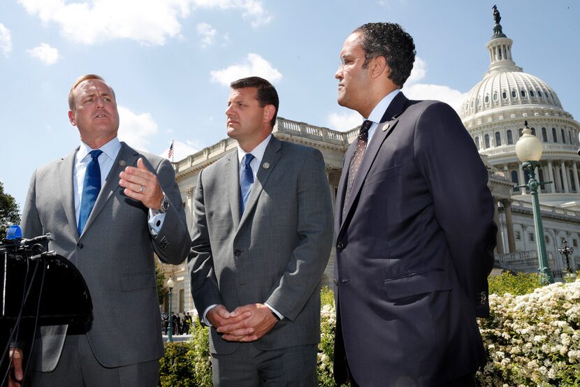 Rep. Jeff Denham, R-Calif., left, speaks next to Rep. David Valadao, R-Calif., and Rep. Will...