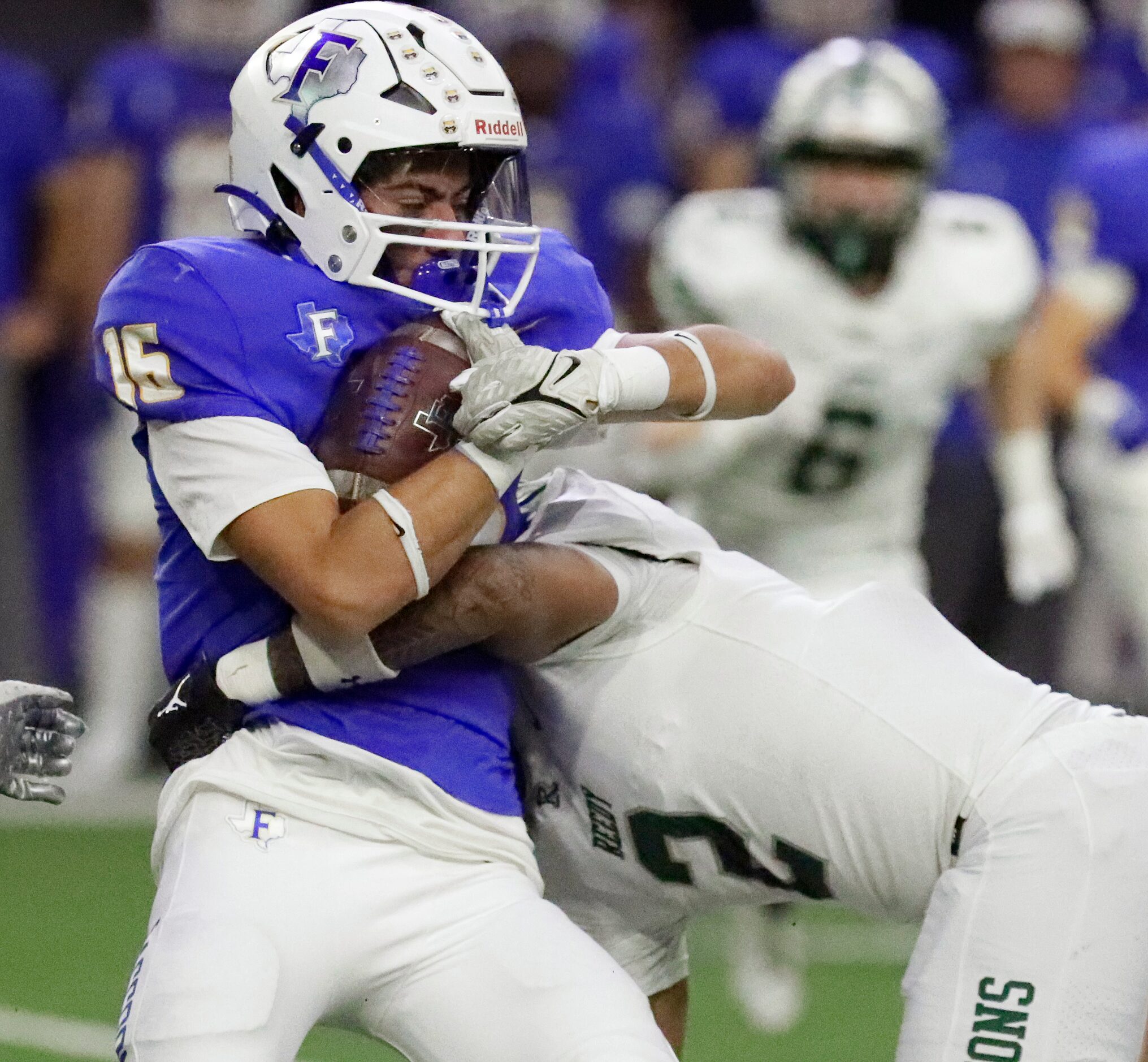 Frisco High School running back Jayson Bustamante (16) is tackled by Reedy High School...