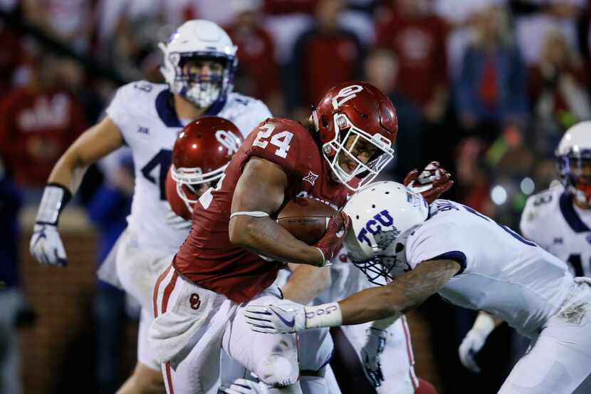 Oklahoma running back Rodney Anderson (24) carries during an NCAA college football game...